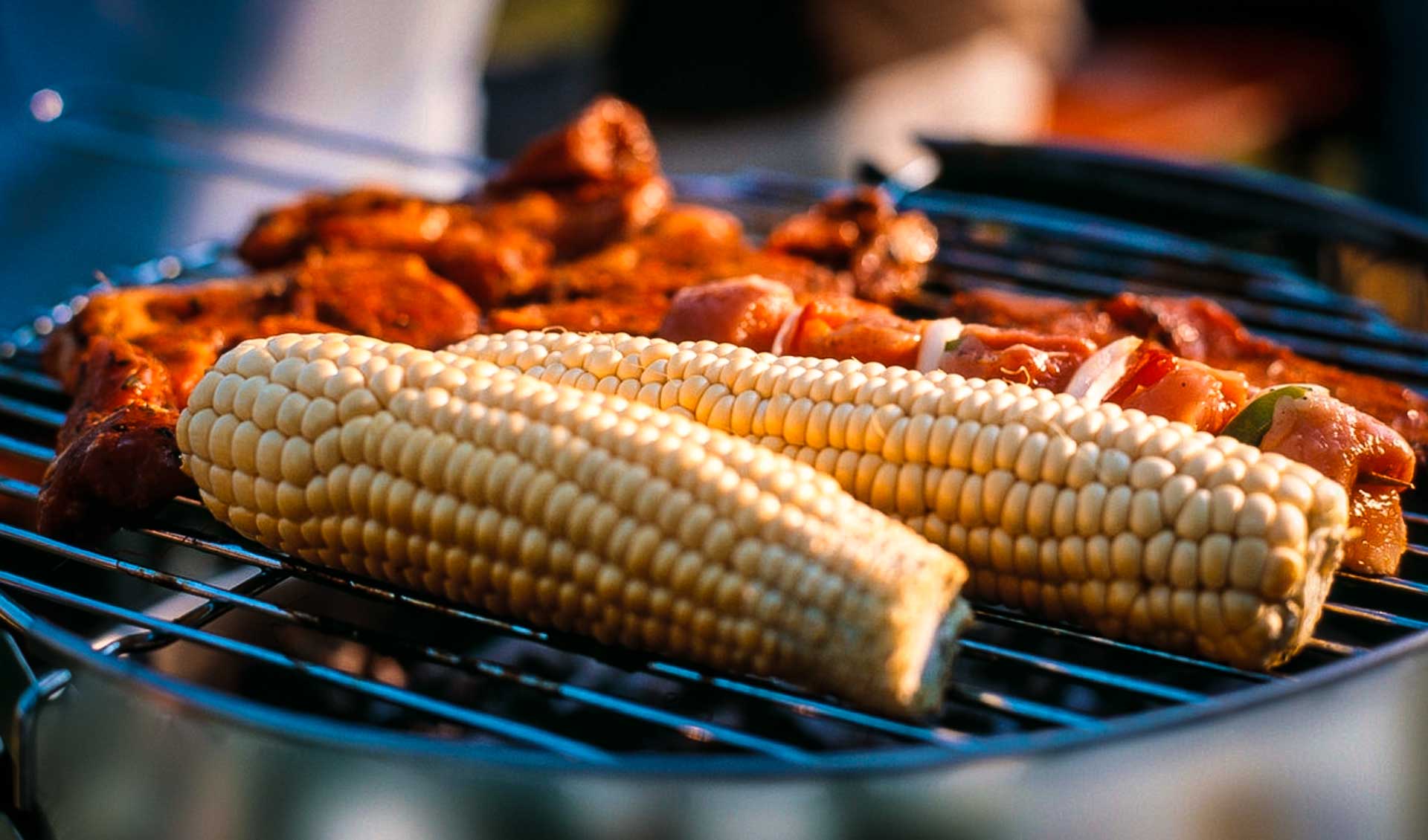 Corn on the cob and grilled meats that are served with catering for river trips in Idaho, Utah and California.